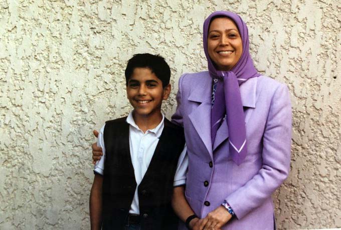 Amir VAfa Yaghmaei  as a child, in Iraq, he poses alongside Maryam Rajavi.